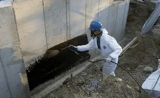 Professional waterproofing the exterior walls of the basement in West Palm Beach, FL