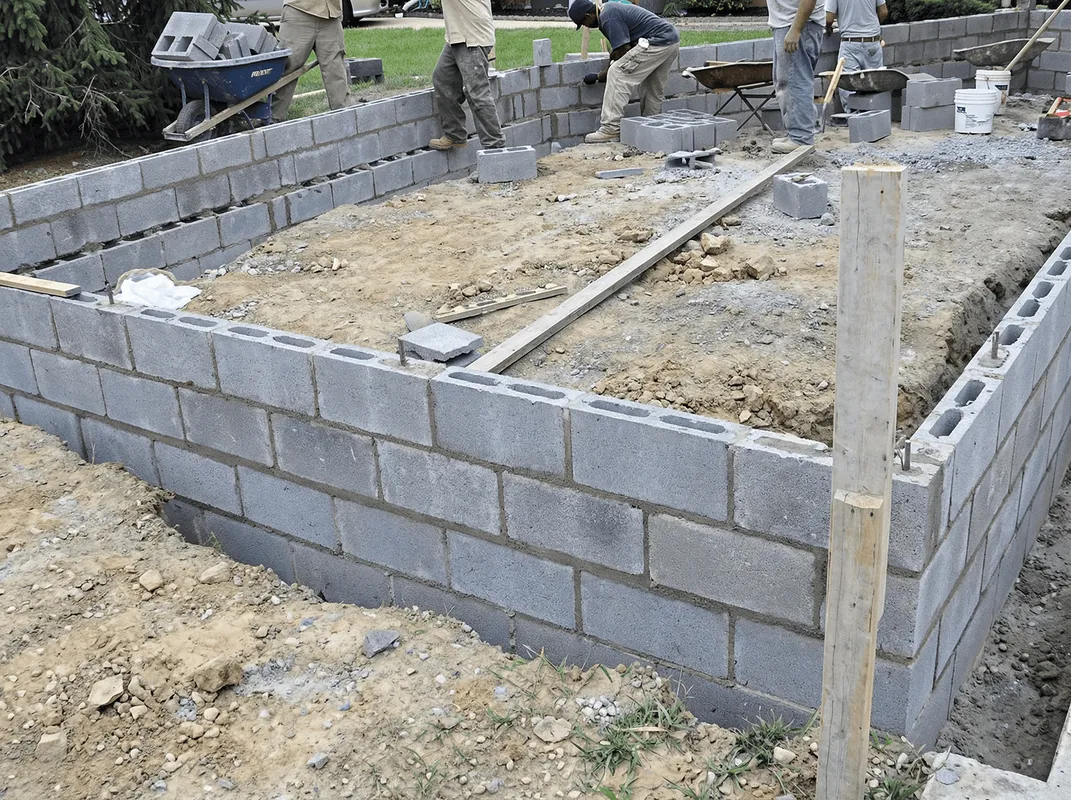 Professionals building a foundation with blocks in West Palm Beach, FL