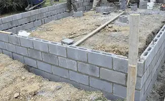 Professionals building a foundation with blocks in West Palm Beach, FL