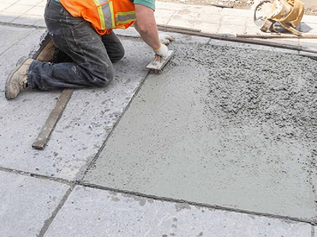 Professional repairing a concrete floor in West Palm Beach, FL