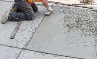 Professional repairing a concrete floor in West Palm Beach, FL